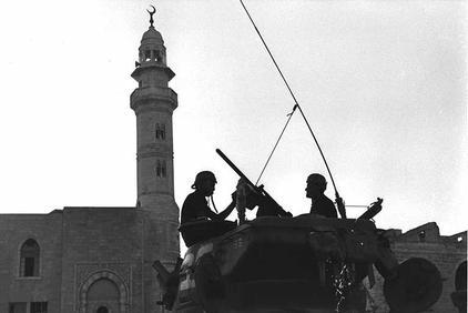 unknown photographer, gpo,  one of the israeli tanks in front of the mosque on the main square in bethlehem, june 1967