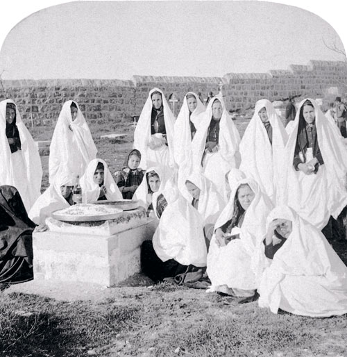 b.w. kilburn, women in white visiting the tombs daily to mourn, 1898